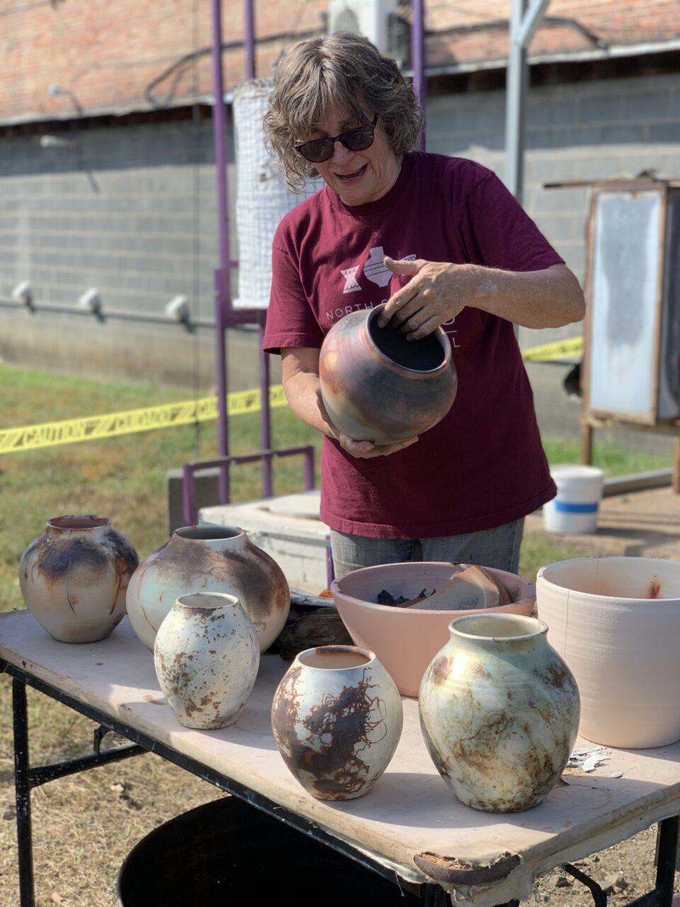 Judi Harwood unwrapping sagger pots