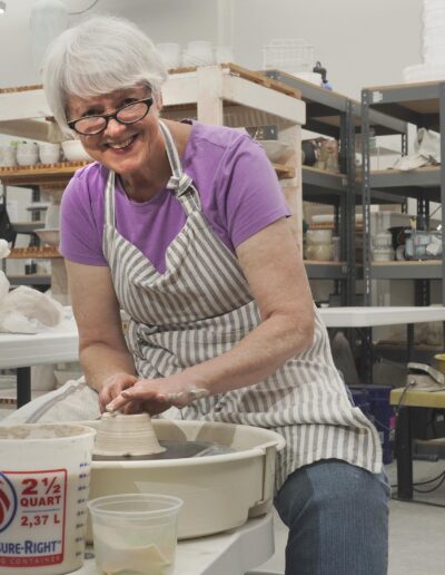 Candy Gallagher throwing at potters wheel in ISM studio