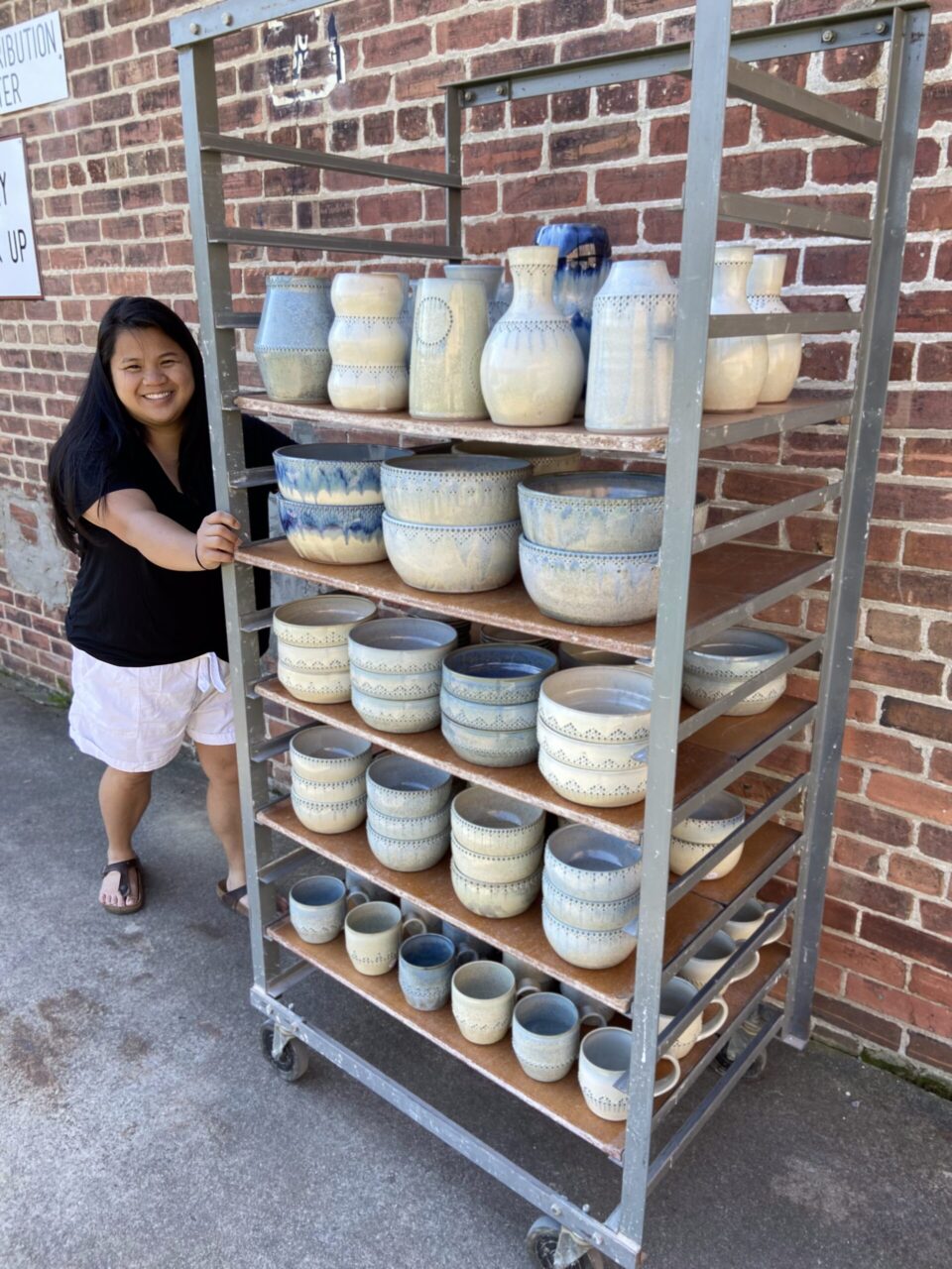 Katie Meili Messersmith with ware cart full of her finished pots, dot pots, abundance