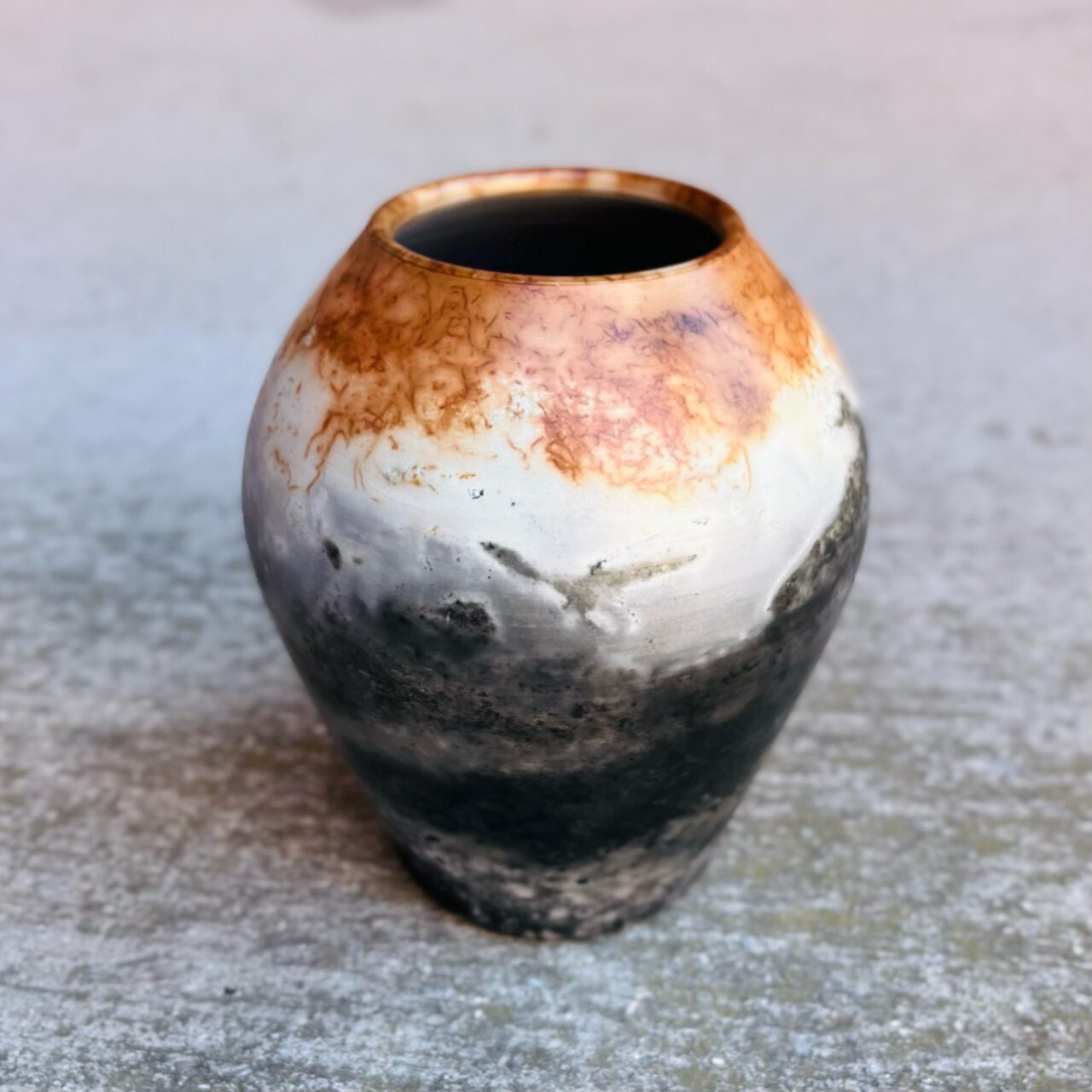 Judi Harwood finished pot, sagger fired, eagle, landscape