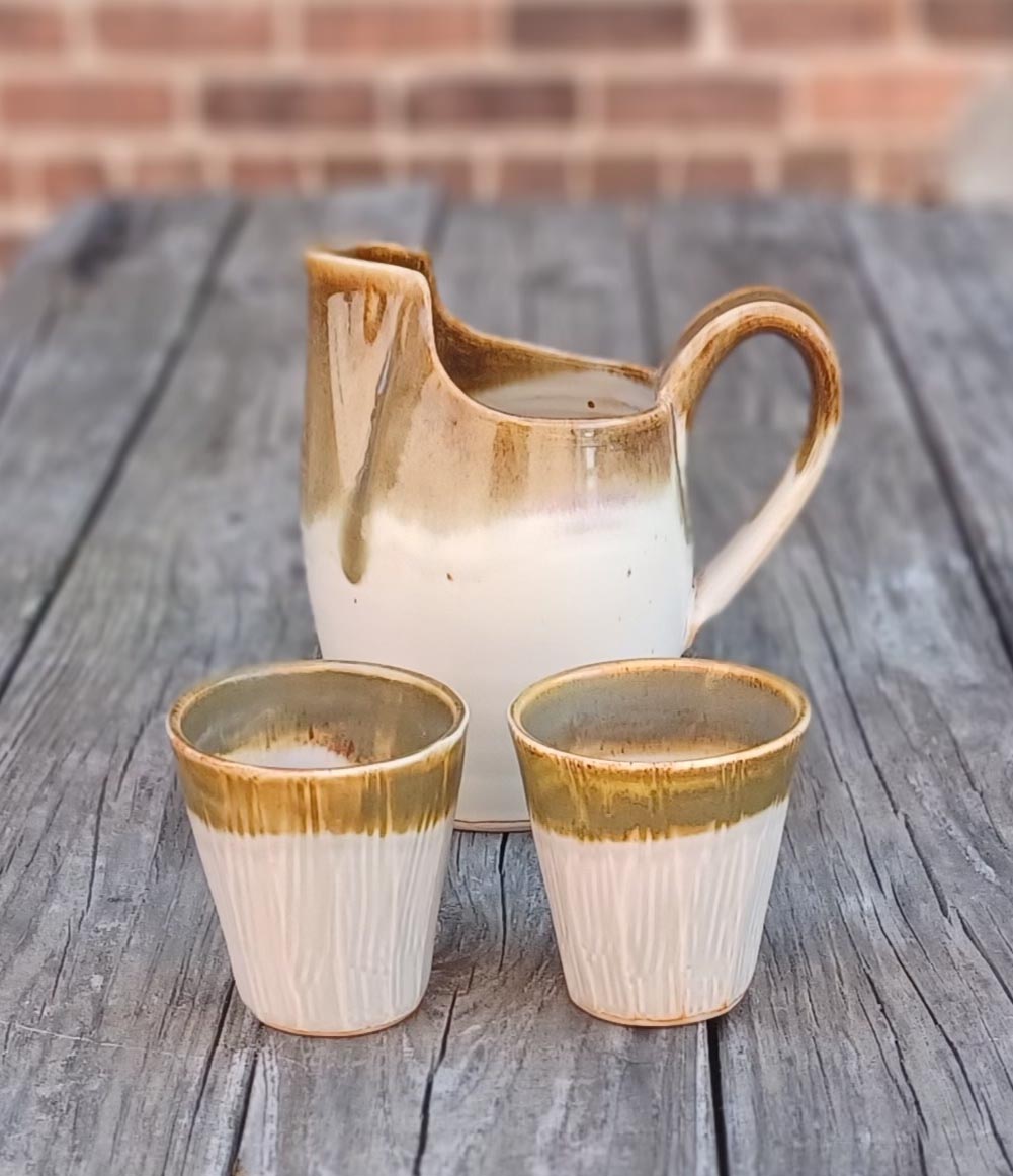 Julia Mann finished pots, cups and pitcher set