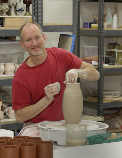 Clive throwing on the potters wheel in ISM community studio
