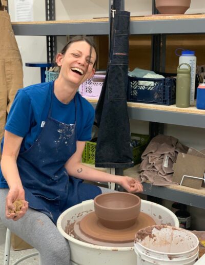 Diana Hoover, Knook Ceramics, throwing in ISM space, smiling