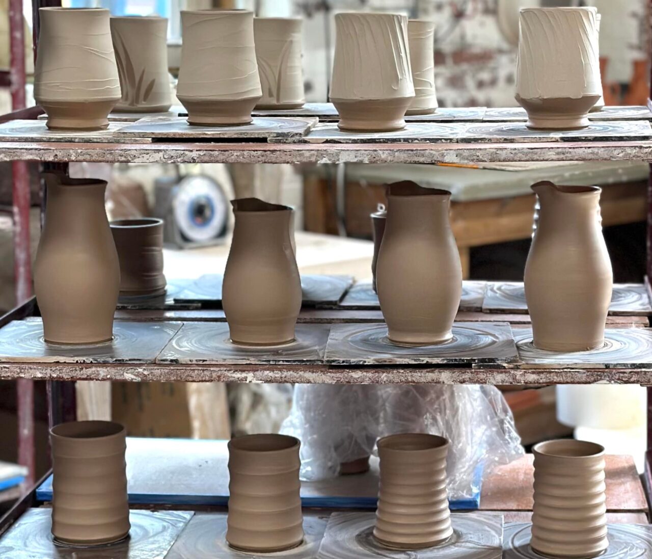 Sarah Wells Rolland fresh thrown pots on ware cart abundance, our stock image