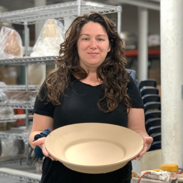 Amanda Bragaw square headshot with leather-hard pot