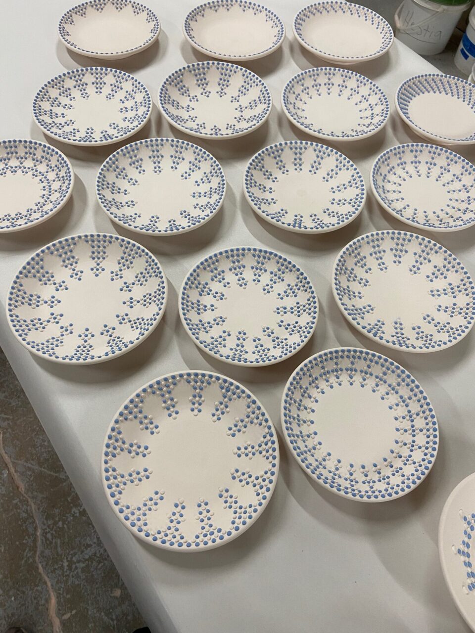 Katie Meili Messersmith dot pots, plates, slip trailing, surface design, abundance bisqueware, birdseye view, our stock image