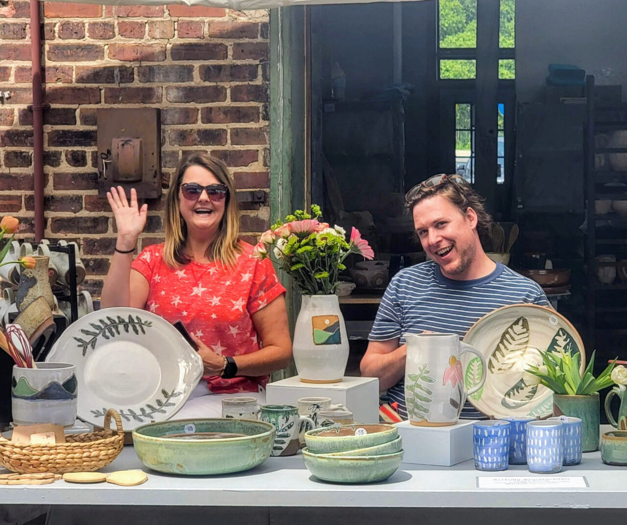 Shapes of Summer show, ISM participant show, Missy Henry and Chad Caldwell at their booth, Independent Study and Mentoring Advanced Studies Program, cropped